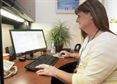 Laura Perry, a 60-year-old transgender civilian Airman who works as a social worker, checks emails at mental health clinic on Patrick Air Force Base, Fla., Feb. 22, 2016. Perry decided to become a woman after serving 20 years in the Air Force, and now volunteers for a transgender advocacy group. (U.S. Air Force photo/Sean Kimmons)