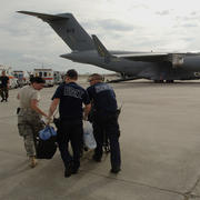 Lakefront Airport, LA - A member of the 514th Aeromedical Evacuation Squadron and two New Orleans Paramedics