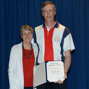 Calvin Meyer, standing with Interior Secretary Sally Jewell, displays his award at the 2nd annual U.S. Department of Interior Cu