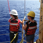 Two scientists connect the umbilical and the winch line to ensure our ROV is stable.