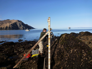 Here, Chief Jim Jacobson, Lead Survey Technician, sets up a staff, or meter stick, I used to measure the change in water depth and others used for leveling.