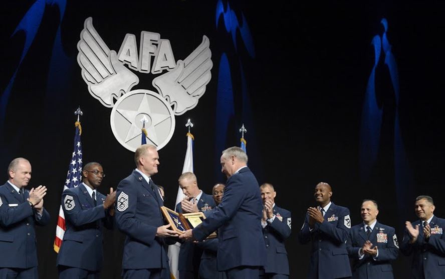Chief Master Sgt. of the Air Force James A. Cody thanks Air Force Chief of Staff Gen. Mark A. Welsh III for his exceptional service by presenting him with an invitation to an Order of the Sword ceremony following his "Enlisted Force Update" at Air Force Association's Air and Space Conference and Technology Exposition, Sept. 16, 2015, in Washington, D.C.  (U.S. Air Force photo/Scott M. Ash)
