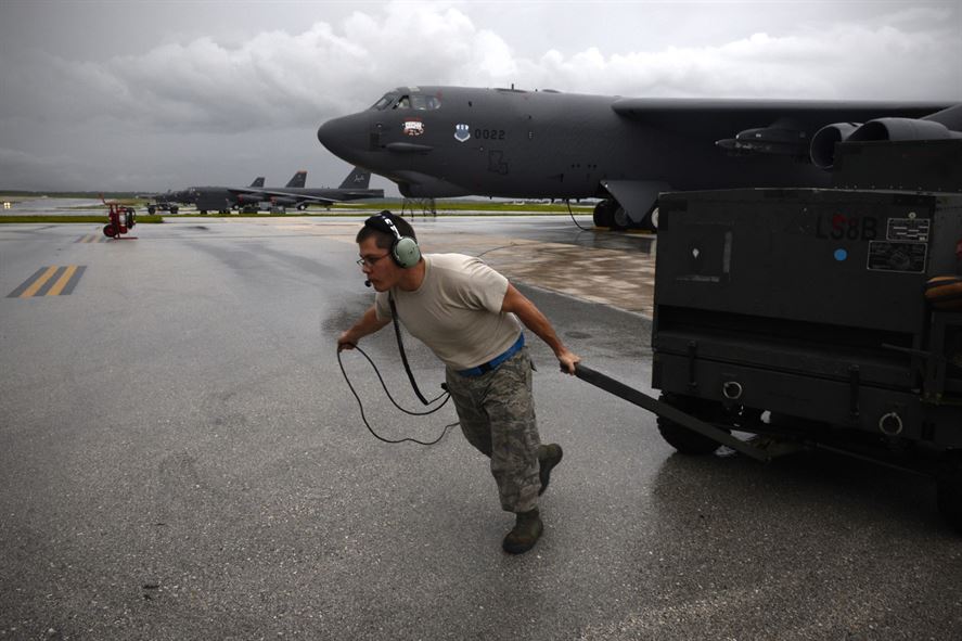 Staff Sgt. Stephen Cole, a B-52 Stratofortress crew chief assigned to the 20th Expeditionary Aircraft Maintenance Squadron, moves ground equipment during aircraft launch operations Aug. 22, 2015, at Andersen Air Force Base, Guam. Bomber crews with the 20th Expeditionary Bomb Squadron are part of U.S. Pacific Command’s continuous bomber presence and support ongoing operations in the Indo-Asia-Pacific region. (U.S. Air Force photo/Staff Sgt. Alexander W. Riedel)