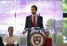 Man standing at lectern (Courtesy of Hamze “Leo” Sukkar)