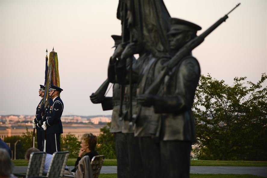 Members of the Air Force Honor Guard stand by to present the colors during a wreath-laying ceremony commemorating the 70th anniversary of the end of World War II, Aug. 14, 2015, at the Air Force Memorial in Arlington, Va.  (Air Force photo/Tech. Sgt. Joshua L. DeMotts)