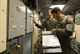 Second Lt. Nikolas Ramos, 320th Missile Squadron deputy missile combat crew commander, reads a checklist while 1st Lt. Terrence Dale Duarte, missile combat crew commander, complies with the instructions in a launch control center at F.E. Warren Air Force Base, Wyo., Nov. 5, 2016. The 90th Missile Wing sustains 150 Minuteman III ICBMs and the associated launch facilities that cover 9,600 square miles across three states. (U.S. Air Force photo/Staff Sgt. Christopher Ruano)