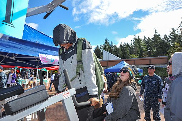 A fairgoer experiences the "Weight of Sexual Assault" to know what to do in the aftermath of a sexual assault, understand retaliation, and how to report it during Naval Base Kitsap's Annual Sexual Assault Prevention and Response Carnival in recognition of Sexual Assault Awareness Month at Naval Base Kitsap - Bangor. The carnival featured multiple activity booths to educate fair goers on the hardships faced by survivors of sexual assault and harassment.  U.S. Navy photo by Mass Communication Specialist 3rd Class Charles W. Gaddis IV (Released)  150424-N-EC099-005