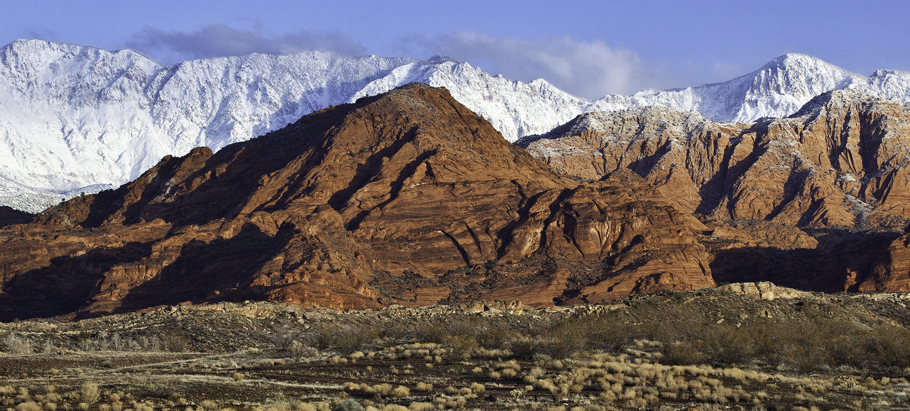 Red Cliffs NCA in the winter with snow-capped peaks in the distance. 