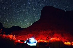 A tent is lit up by lamps in the Big Bend Campground outside Moab, Utah. 