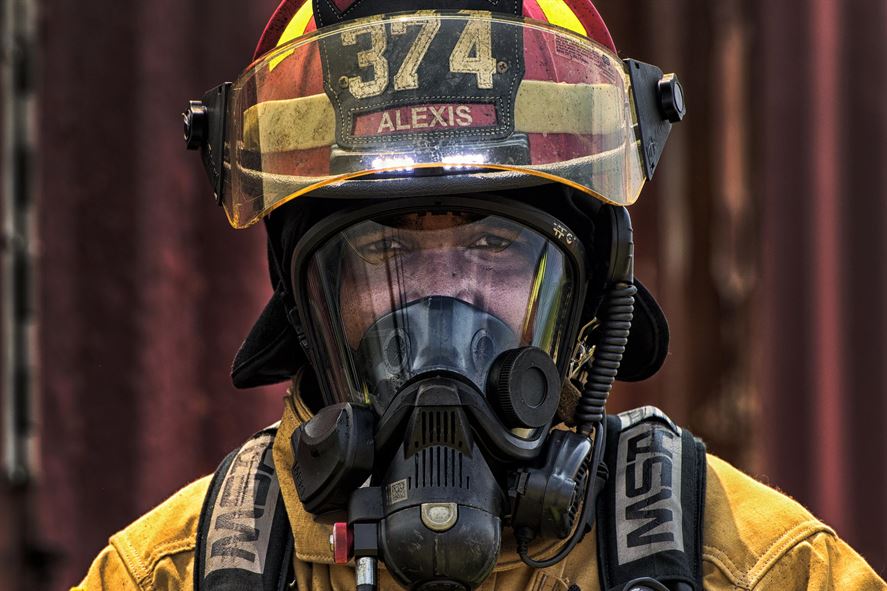 Staff Sgt. Trevor Alexis, a 374th Civil Engineer Squadron fire protection NCO in charge of training, waits to enter a flashover trainer Aug. 4, 2015, at Yokota Air Base, Japan. Flashover, a near-simultaneous ignition of many objects in a confined room, creates a dangerous situation where both heat and smoke continue to increase until combustion. Simulating a flashover fire in a confined room with limited ventilation, enables a trainer to educate and prepare firefighters to recognize and react to a potentially dangerous situation. (U.S. Air Force photo/Airman 1st Class Delano Scott)