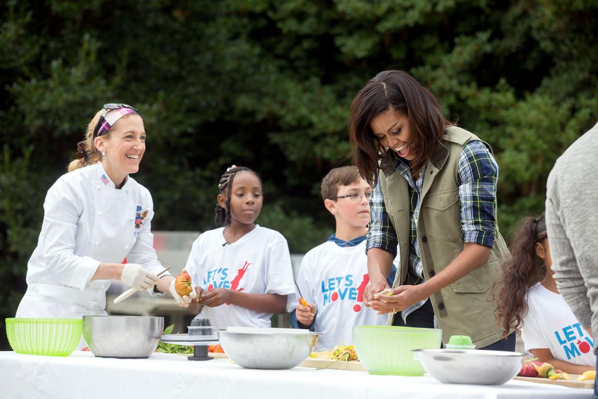 The First Lady prepares a healthy meal with White House chefs and students.
