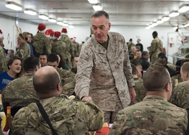 Marine Gen. Joseph F. Dunford, Jr., chairman of the Joint Chiefs of Staff, and Command Sgt. Maj. John W. Troxell, Senior Enlisted Advisor to the Chairman of the Joint Chiefs of Staff, meet with deployed service members at bases across Iraq, Dec. 25, 2016. Dunford, along with USO entertainers, visited service members who are deployed from home during the holidays at various locations across the globe. This year’s entertainers were Chef Robert Irvine, Wrestler Gail Kim, Musicians Kellie Pickler and Kyle Jacobs, and Roastmaster Jeff Ross. (DoD photo by Navy Petty Officer 2nd Class Dominique A. Pineiro/Released)