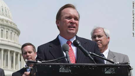 Rep. Mick Mulvaney (R-SC) (3rd R) speaks during a news conference with a bipartisan group of House members outside the U.S. Capitol May 20, 2014 in Washington, DC.