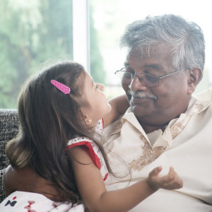 Portrait Indian family at home. Grandparent and grandchild close up face. Asian people living lifestyle. Grandfather and granddaughter.