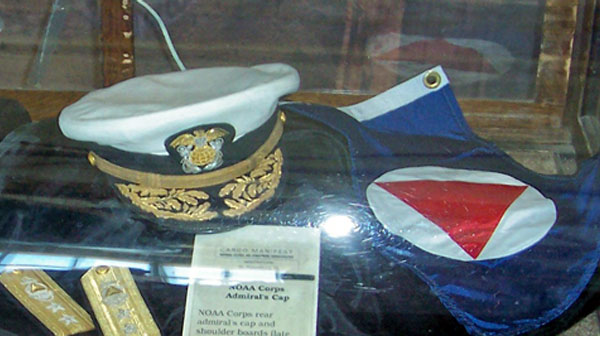 photo of a captian's hat and flag