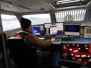 Hydrographic Assistant Survey Tech Chris Palmer keeping track of data.