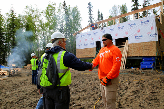 Galena, AK, June 12, 2014--  FEMA Region 10 Administrator Ken Murphy (L) greets Samaritans Purse Volunteer Keith Smith as they inspect the building of Cold Climate Homes for the disaster survivors whom are eigible for FEMA assistance. Each one of the homes will take approximately 8 weeks to complete and are being built concurrently by volunteers from Samaritans Purse and United Methodist Volunteers in Mission, while FEMA pays for materials and shipping. Adam DuBrowa/ FEMA