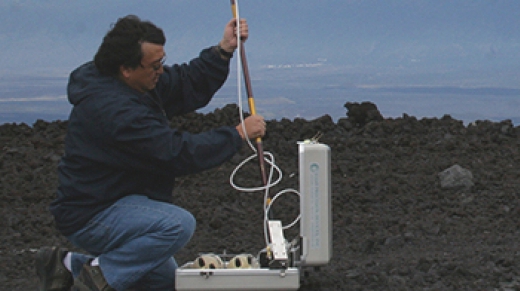 NOAA engineer Paul Fukumura-Sawada captures air near NOAA’s Mauna Loa Observatory in Hawaii, using one of many methods to measure carbon dioxide and other greenhouse gases in Earth’s atmosphere.