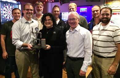 Donna Smigel, Headquarters USACE Centers of Expertise Program Manager is presented with a symbol of appreciation from the Omaha District Fueling Systems (POL-MCX) Mandatory Centers of Expertise Program Manager Gregory Etter and a fuel task force of engineers. 