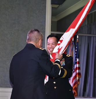 Brig. Gen. Mark Toy, incoming LRD Commander, accepts the USACE flag from Lt. Gen. Todd Semonite, Chief of Engineers and USACE Commanding General, during a change of command ceremony in Cincinnati on August 31, 2016.