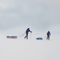 Two people skiing