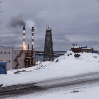 Snowy oil derrick with flaring