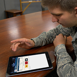 Service member looking at Mood Hacker on a tablet