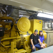 Here, Dana Reid and I take a break at the generator that produces AC electricty.