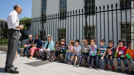 Obama stops to talk with visiting school children outside the West Wing of the White House, April 29, 2015. The President was returning from a walk with Shanna Peeples, the 2015 National Teacher of the Year, when he met the children and their chaperones.