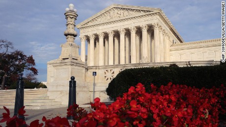 Flowers bloom in front of The United States Supreme Court building November 6, 2015 in Washington, DC. 