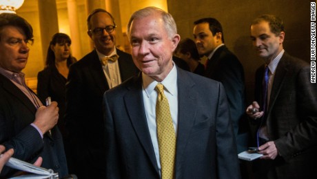 Sen. Jeff Sessions answers questions as he arrives for a meeting of Senate Republicans on a solution for the pending budget and debt limit impasse at the U.S. Capitol October 16, 2013.