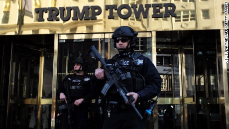 New York Police Department (NYPD) officers guard the main entrance of the Trump Tower, where US President-elect Donald Trump holds meetings, in New York on November 14, 2016. 