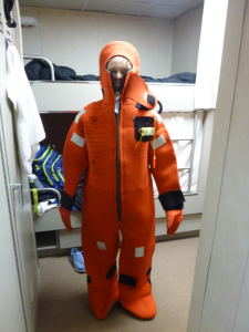 Janelle Wilson wears immersion  suit for abandon ship drill.