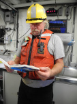 Skilled Fisherman, Steve, enjoys reading about sharks in the dry lab.