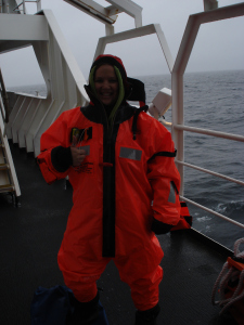 In my "Gumby" Immersion Suit during our Abandon Ship Drill.  This suit is a universal, meaning it can fit people of many sizes, including someone much much taller than me.  Do I look warm?  (Photo courtesy of Vessel Assistant Carl Stedman.)