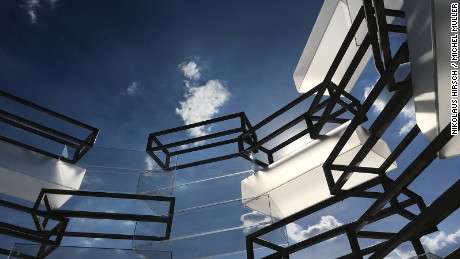 Museum of Immortality, Mexico -- Standing over 26 feet tall, the pavilion comprises 15 layers of body-sized acrylic boxes of varying opacity. Inspired by museum vitrines, Nikolaus Hirsch and Michel Müller created a circular design that resembles a spaceship, reaching upwards towards the heavens.