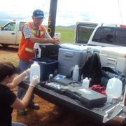 Photo of scientists conducting water chemistry tests for the San Pedro River aquifer. 