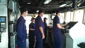 Several NOAA Corps Officers on the bridge while coming in to port in Kodiak.