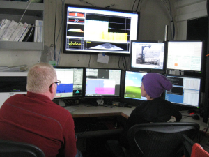 Randy (left) and Brandy (right) working on ship survey by monitoring the systems, drawing lines for navigation, and ensuring that good data is being collected.