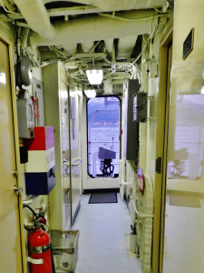 Passageways are narrow, from deck (floor) to bulkhead (ceiling)