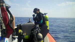 Marine Scientist, Danielle Morley, ready for the signal to dive and retrieve a VR2.