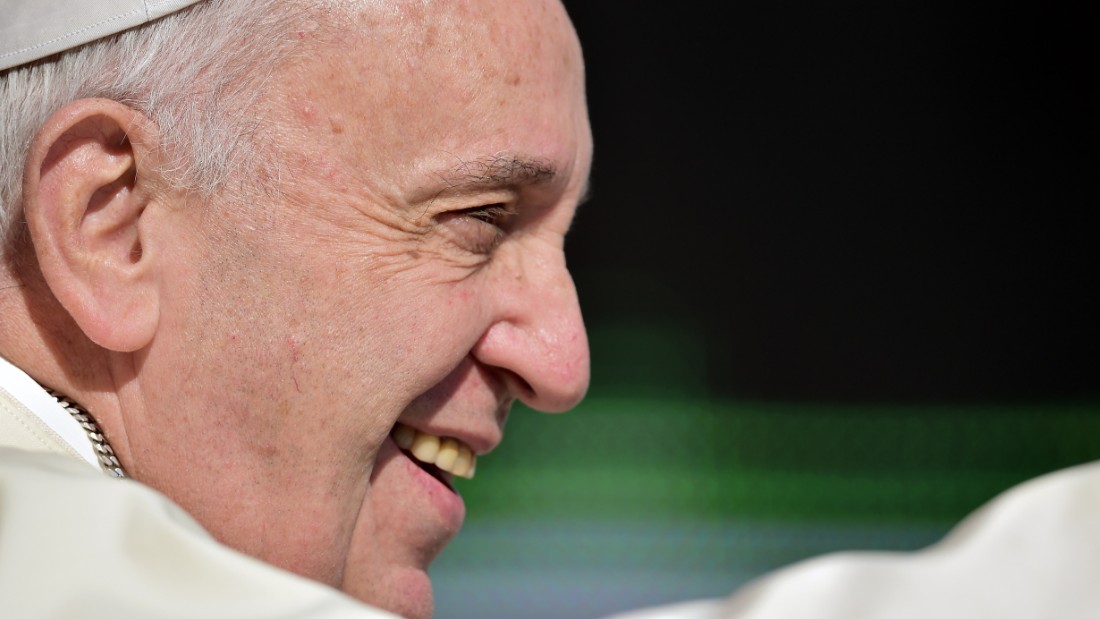 Pope Francis waves as he&#39;s driven through Saint Peter&#39;s Square at the Vatican to lead his weekly general audience on August 26, 2015.