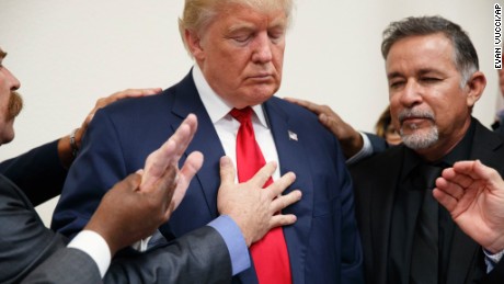 Pastors from the Las Vegas area pray with Republican presidential candidate Donald Trump during a visit to the International Church of Las Vegas, and International Christian Academy, Wednesday, Oct. 5, 2016, in Las Vegas. (AP Photo/ Evan Vucci)