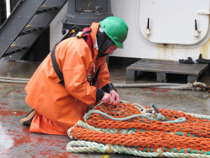 Kerri tying up the trawl net after pulling in a big haul of salmon. 