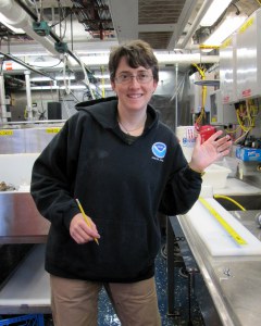 Ellen showing off a tiny squid that she was measuring on the scale. 