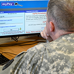 Service member at computer