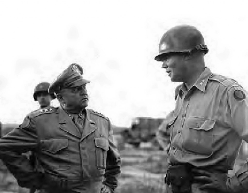 U.S. Army Maj. Gen. William F. Dean, right, greets Army Gen. Walton H. Walker upon his arrival in Taejon, South Korea, July 7, 1950. National Archives photo/Released
