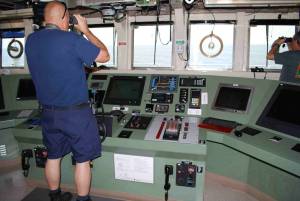 Commander Jeremy Adams looks out from Pisces’ bridge Photo credit: Richard Hall
