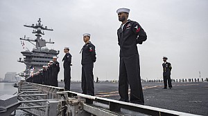 Sailors aboard the aircraft carrier USS Carl Vinson (CVN 70) man the rails as the ship departs its homeport of San Diego.