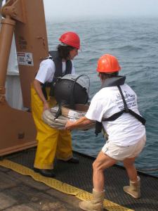 Teachers Amy Pearson and Kim Pratt deploy a drifter buoy 